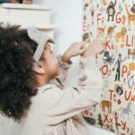 child learning to code on tablet