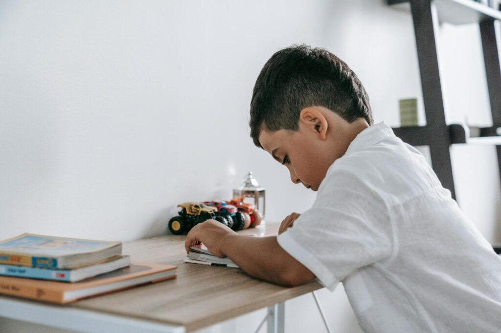 child studying with UK flag