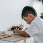 child studying with UK flag