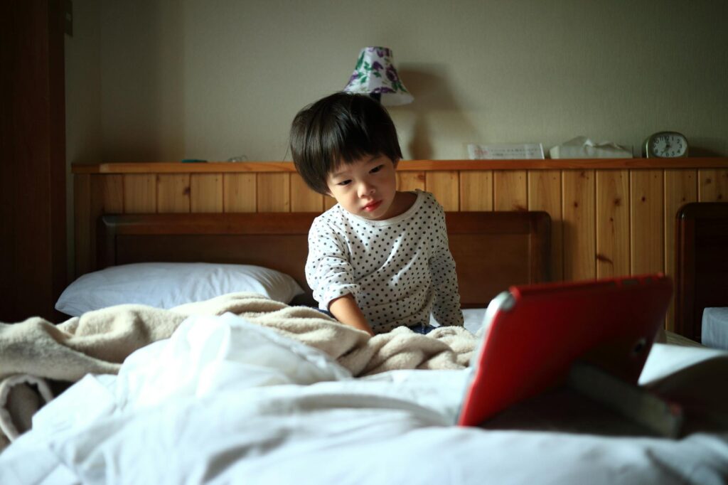 child watching news screen