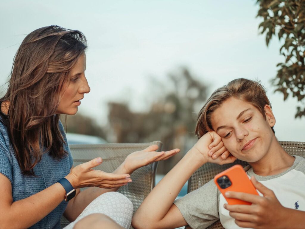 parent and teen looking at tablet