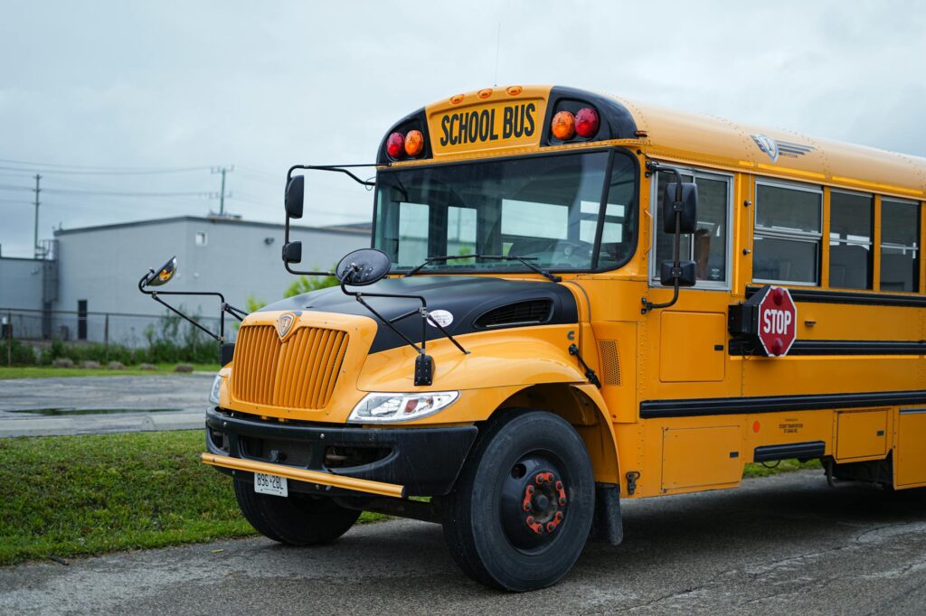 school bus and smiling student