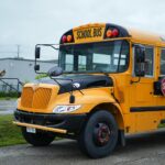 school bus and smiling student