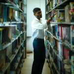 student researching on laptop with parent