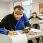 student studying notebook