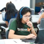 student using laptop UK