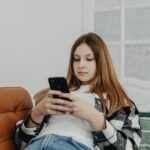 teenager using laptop anonymous cloud storage