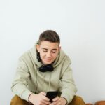 teenager using smartphone with parent