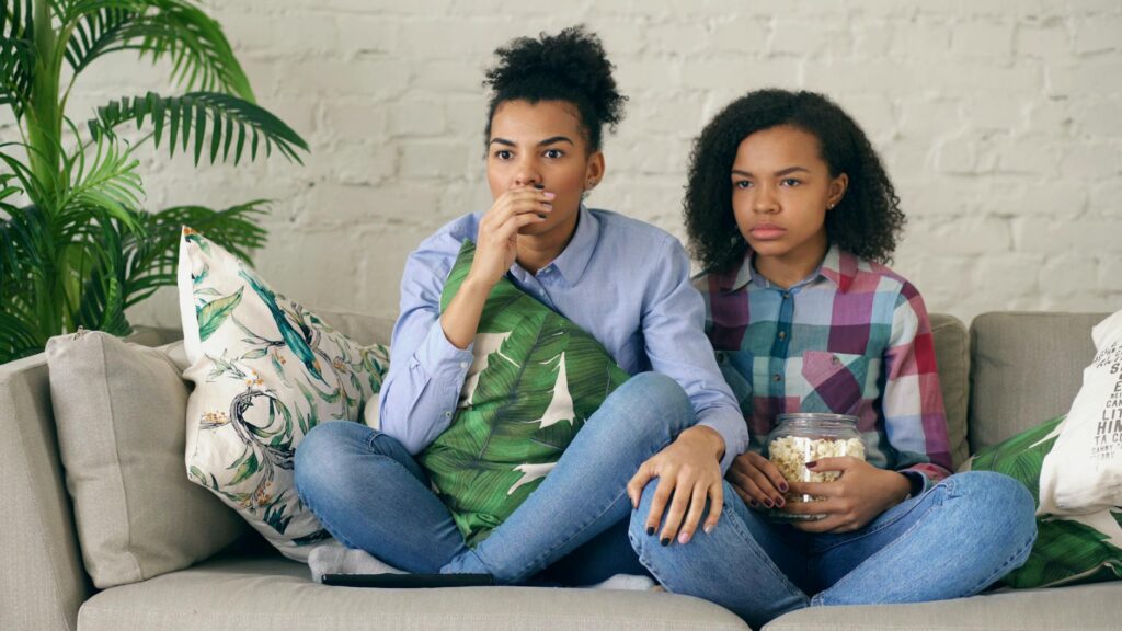 teenagers watching basketball live stream