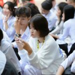 students using tablets classroom