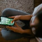 person unplugging phone